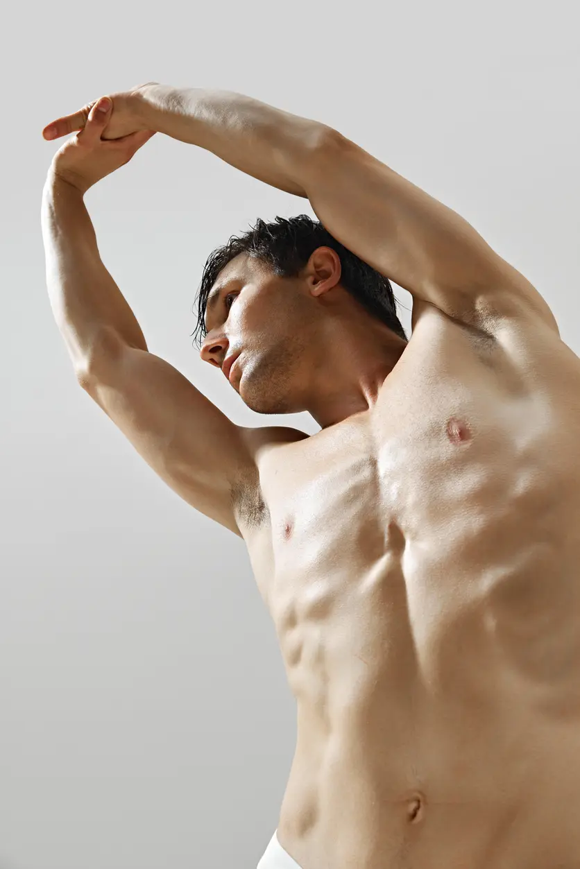 Shirtless man stretching