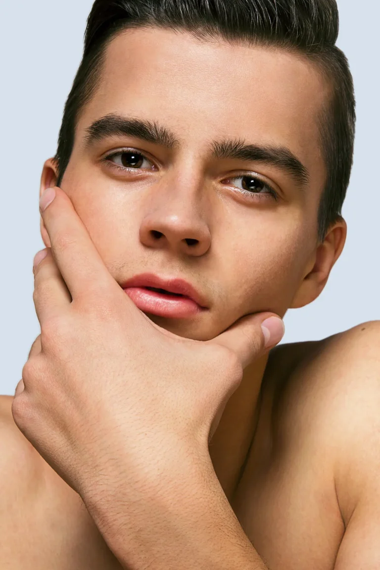Man with hand on chin