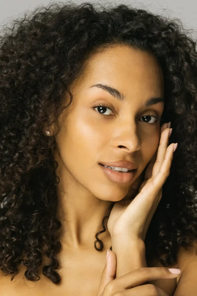 Woman with hand on face